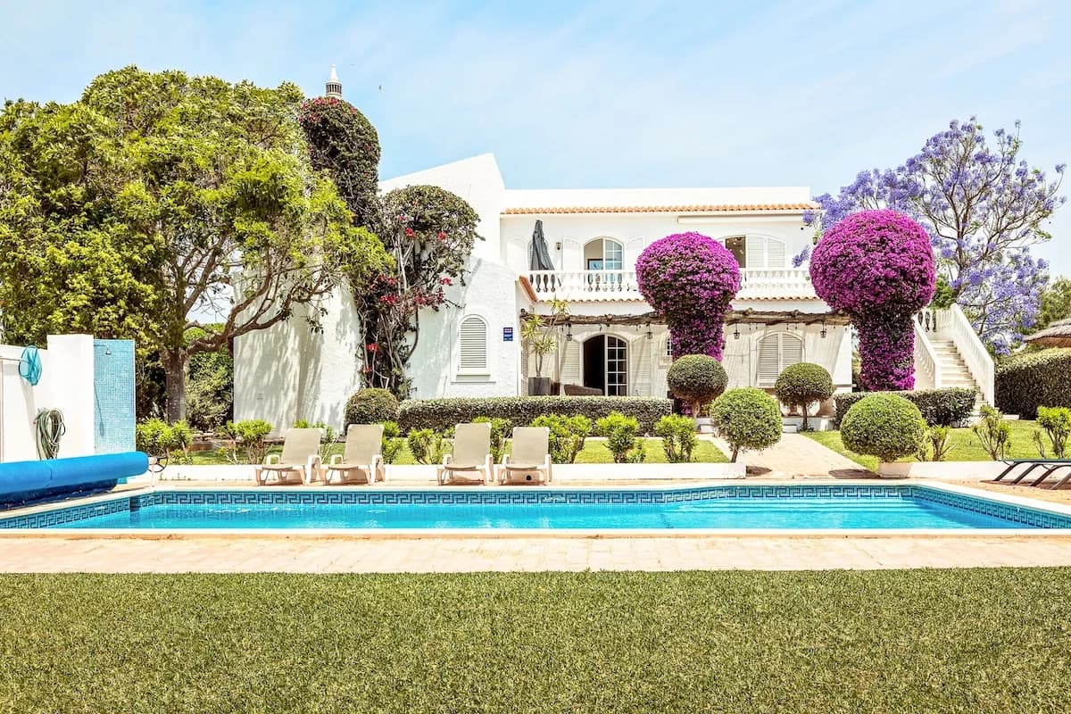 Casa da Parra villa with private pool, sun loungers, and bougainvillea, Guia, Algarve