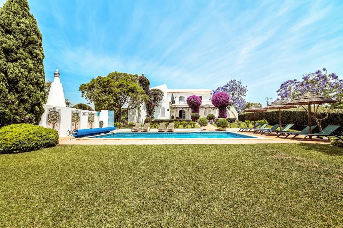 Wide view of pool, garden, and villa at Casa da Parra, Algarve